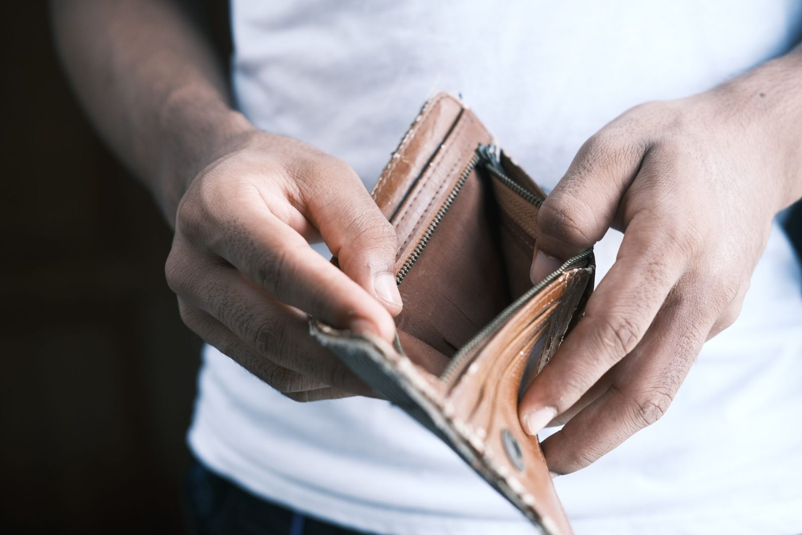 10 Proven Ways to Clear Off Debt The Earliest 1 person holding brown leather bifold wallet